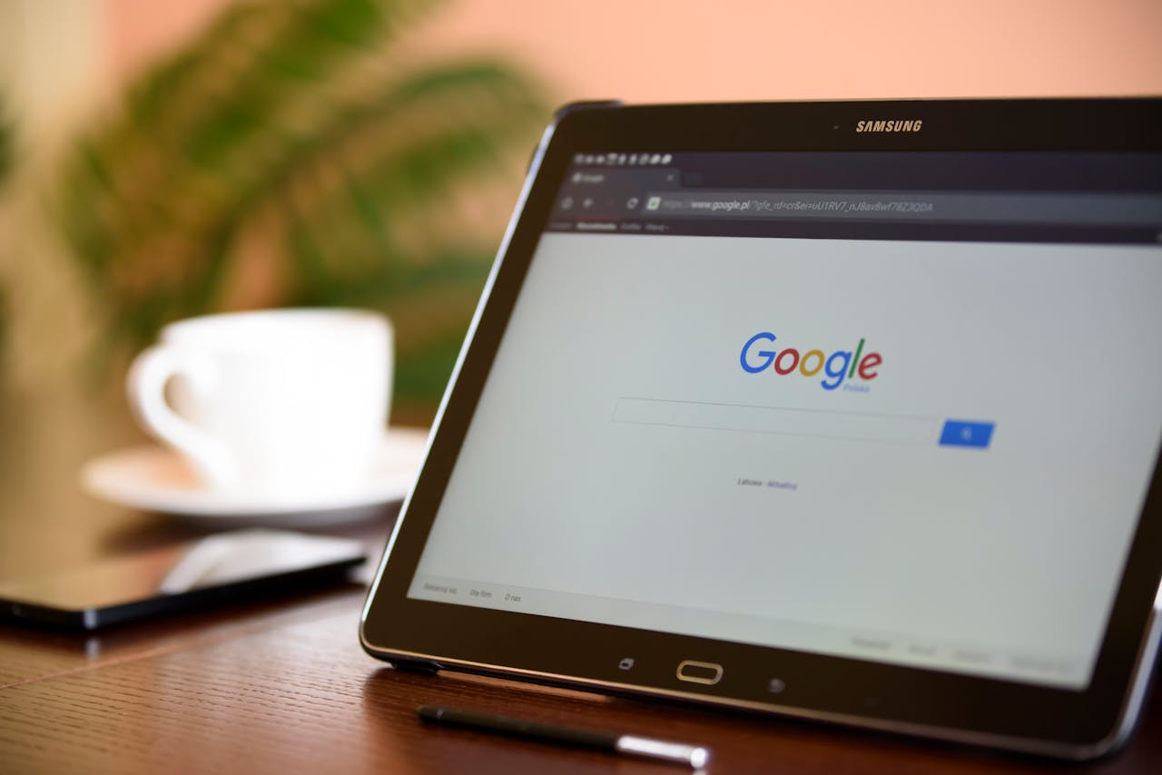 who-we-are Samsung tablet on desk showing Google homepage, perfect for technology-related content.